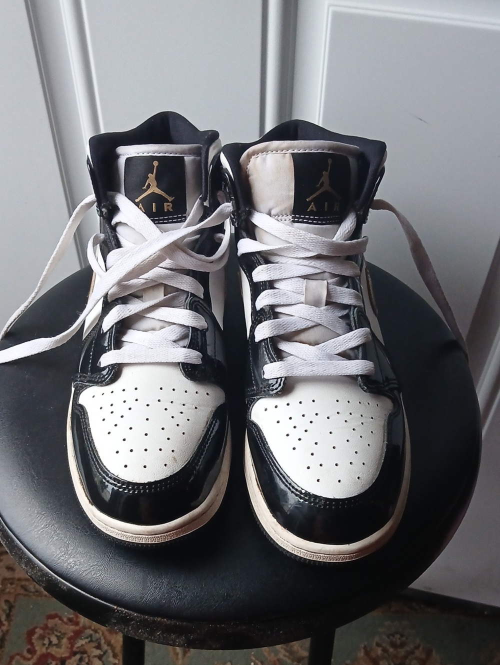 Jordan Kids High-Top Sneakers in Black, White, and Gold
